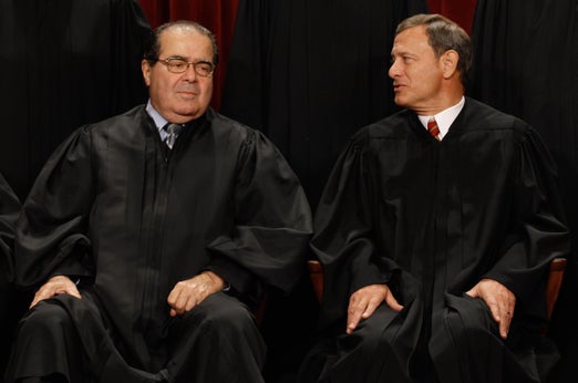Justice Antonin Scalia (left; shown here with Chief Justice John Roberts) had pointed exchanges with Solicitor General Donald Verrilli during Tuesday's arguments regarding the Affordable Care Act's individual mandate
